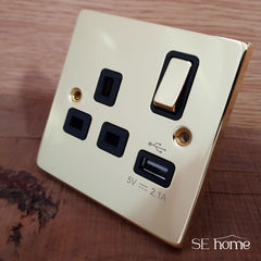 Polished Brass - Black Inserts Polished Brass 1 Gang 13A DP 1 USB Switched Plug Socket - Black Trim